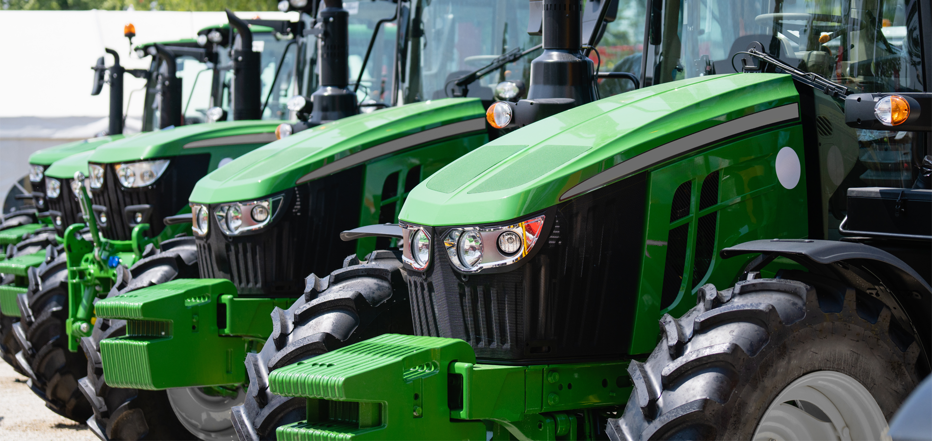 A row of green tractors
