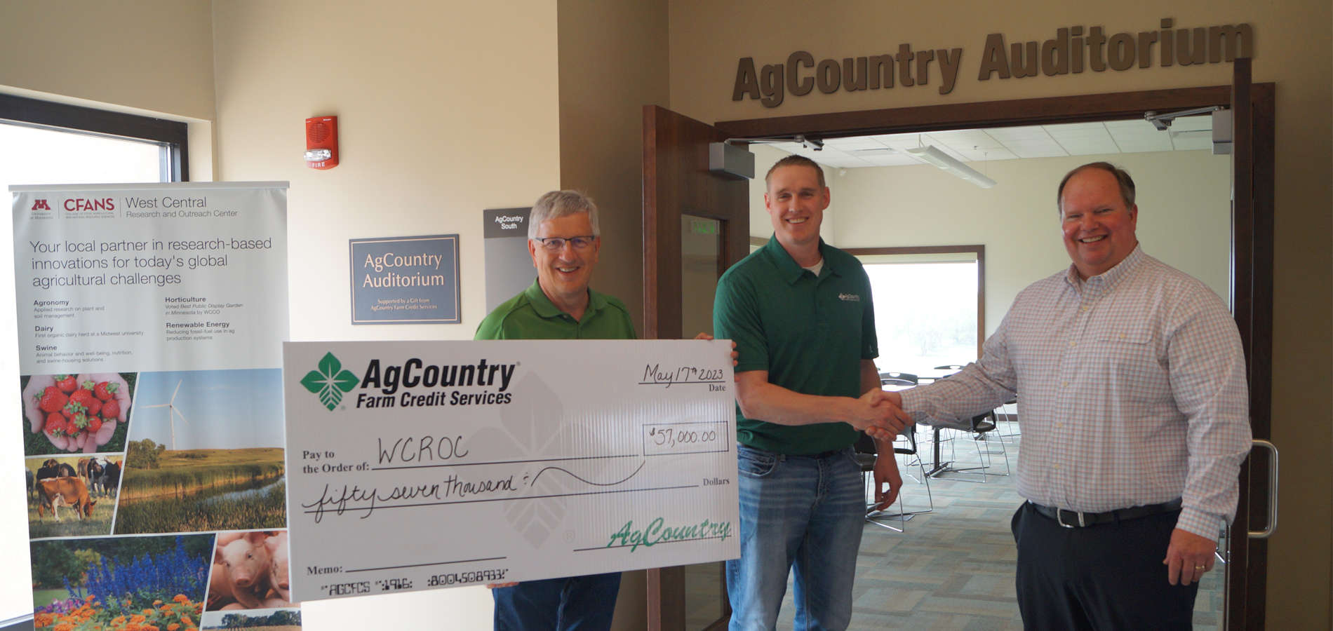 AgCountry employees present donation check to WCROC